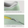 A close-up of a light green U-shaped memory foam neck pillow fabric and an invisible zipper detail.
