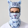 A person wearing a blue and white tiger print ski balaclava with cat ears.