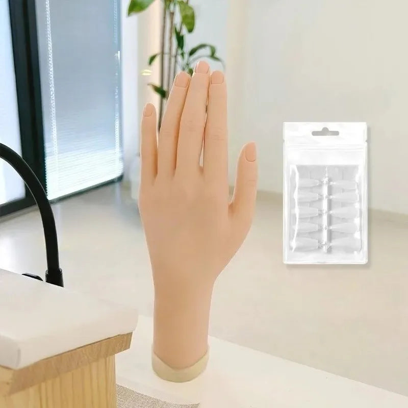 A hand model made of bendable silicone is shown, positioned next to a clear plastic container of nails for manicure training.