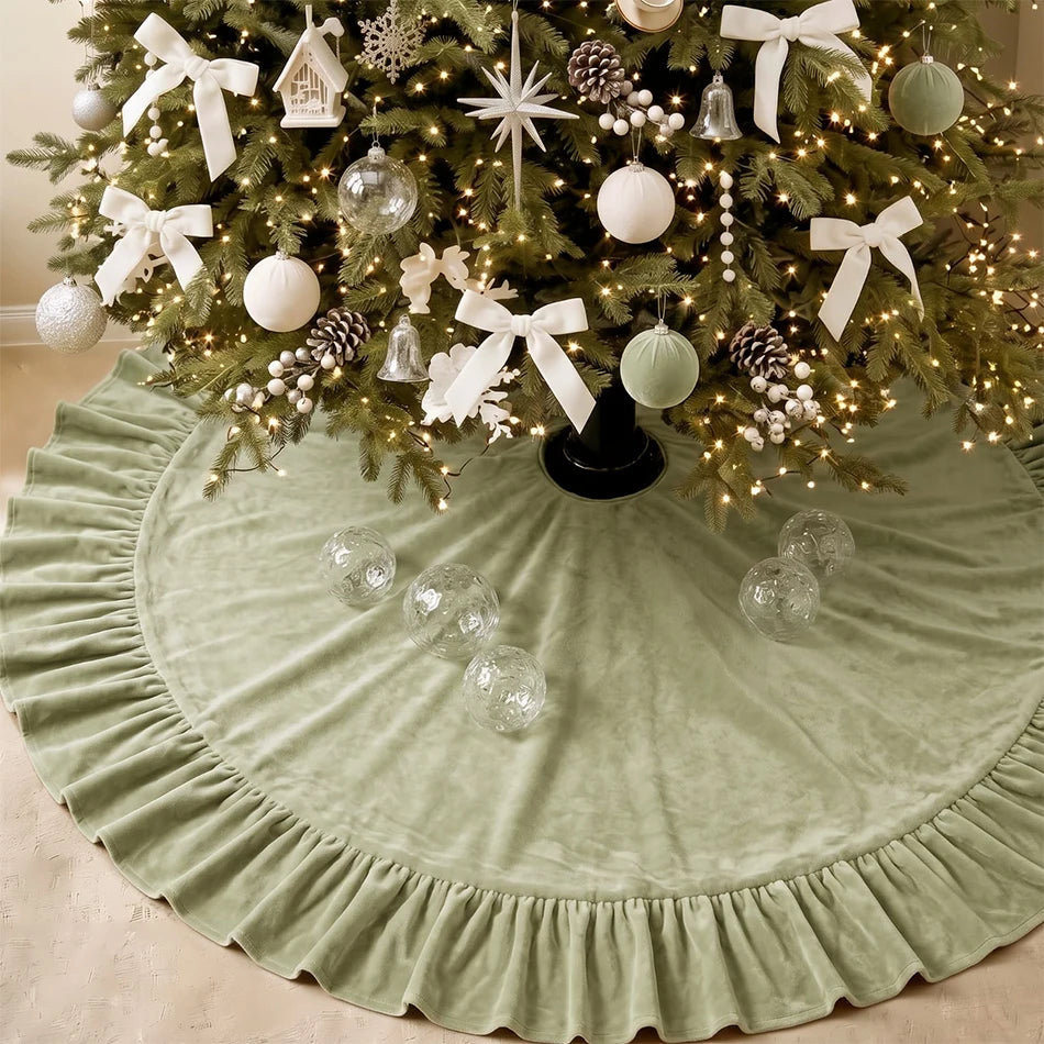 A festive velvet Christmas tree skirt with a ruffled edge decorated with white bows, ornaments, and pinecones.
