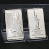 A silver bullion bar replica featuring a depiction of a figure holding a staff and an eagle, set in protective plastic packag