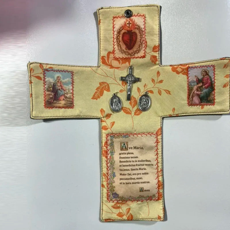 Handcrafted pocket shrine featuring a cross design with decorative elements and text.