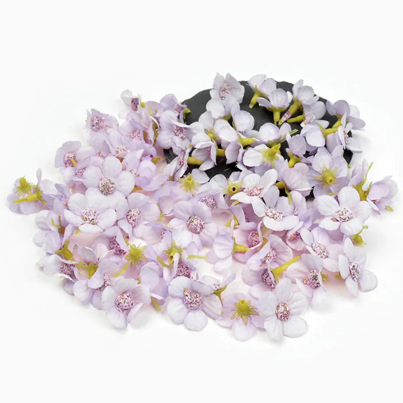 A cluster of light purple silk artificial flower heads used for weddings, crafts, and home decor.
