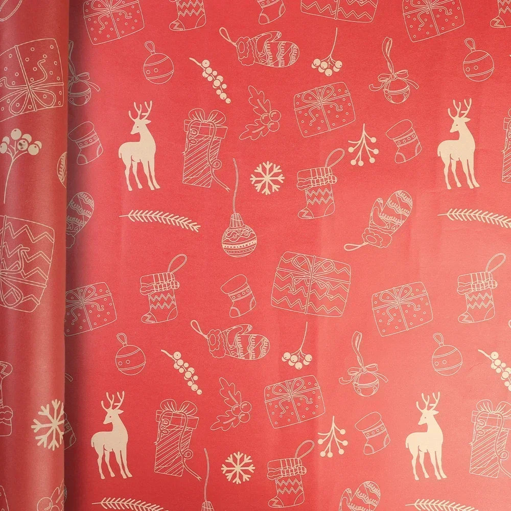 A roll of festive Christmas kraft wrapping paper featuring white illustrations of reindeer, gifts, snowflakes, and greenery o