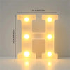 A glowing letter H made of LED lights, used for cozy room or party decor.