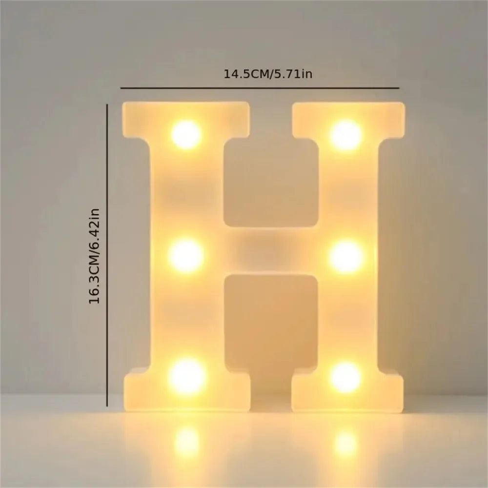 A glowing letter H made of LED lights, used for cozy room or party decor.