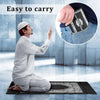 A man is shown easily carrying a portable travel prayer mat with a compass in his hand.