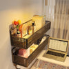A dark brown wire storage basket mounted on a wall, filled with books and small containers.