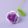 Handmade crochet tulip bouquet featuring purple and white flowers on a green stem
