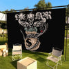 A black wall tapestry featuring a stylized skull and dollar sign design for a street culture hip-hop theme.