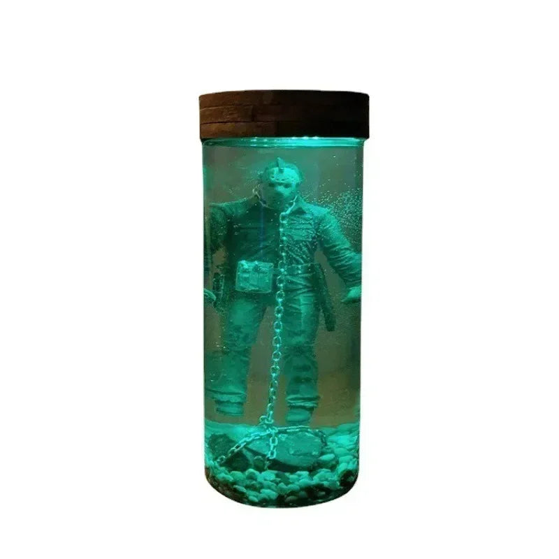 A collectible lamp featuring Jason Voorhees from The 13th Part VI, displayed in a glass jar.