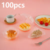 A collection of 100 clear plastic cake slice boxes with lids, including a cup, fruit, and dry ingredients.