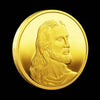 A gold commemorative metal coin featuring a profile portrait of Jesus Christ.