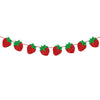 A string of red strawberry-shaped decorations used for a party theme.