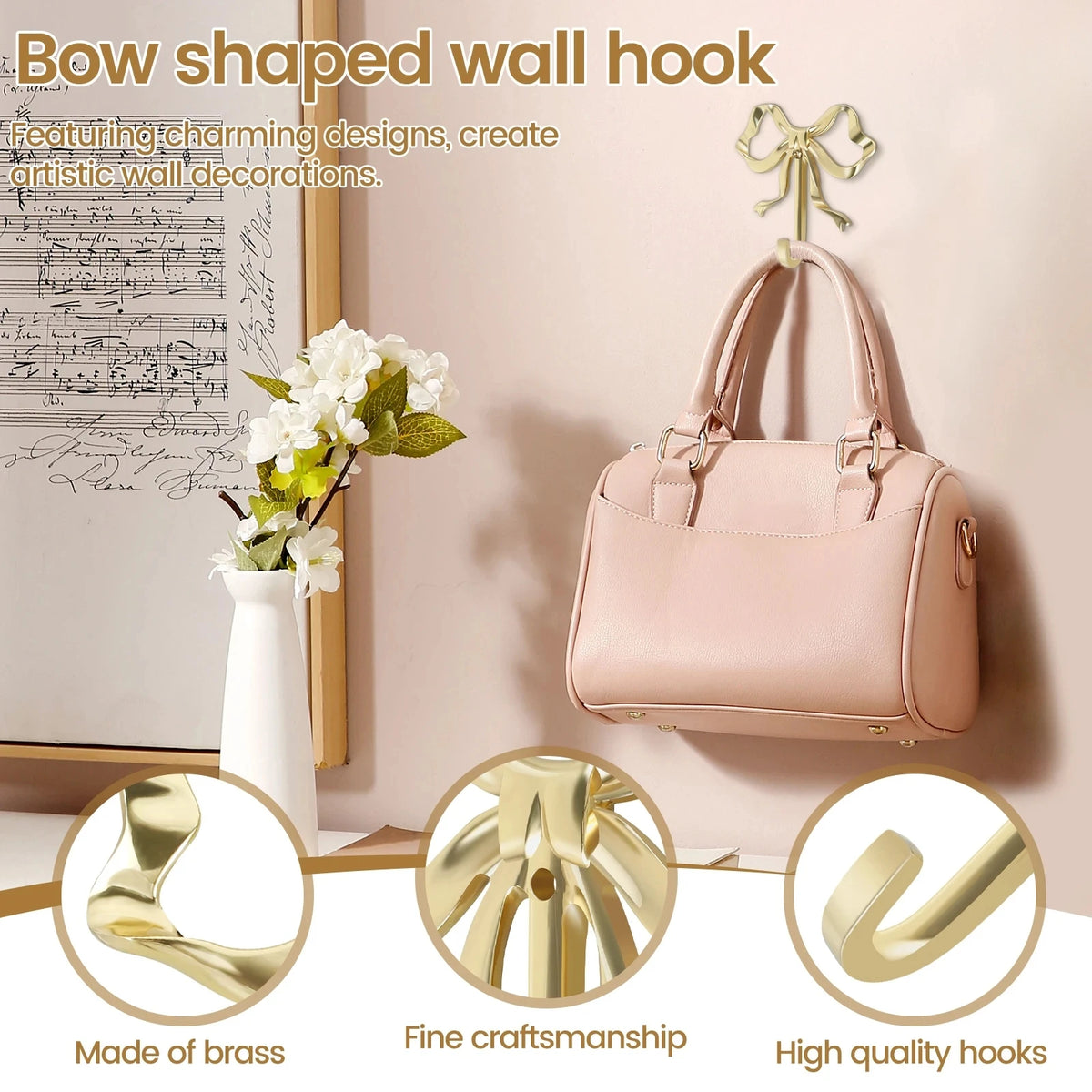 A pink bow-shaped brass wall hook is displayed against a light background, showing its design and quality.