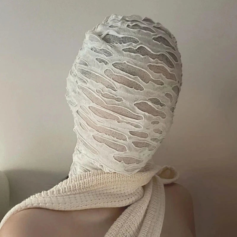 White mesh balaclava face mask worn on a person's head and neck.