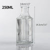 A clear glass bottle with a narrow neck, measuring 250ml, used for various decorative purposes.