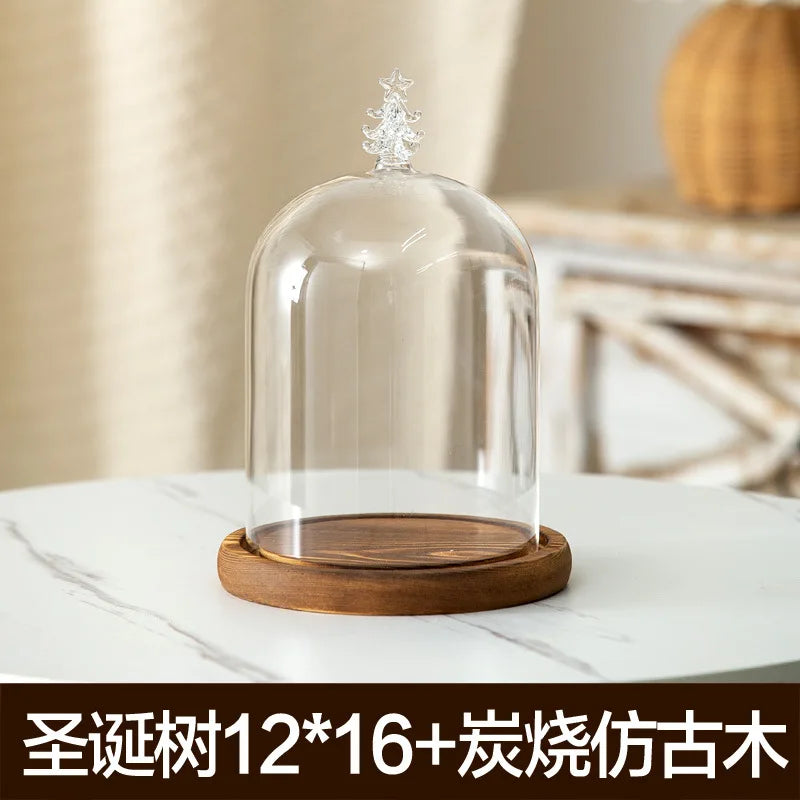 Glass aromatherapy candle holder with a clear dome and a wooden base