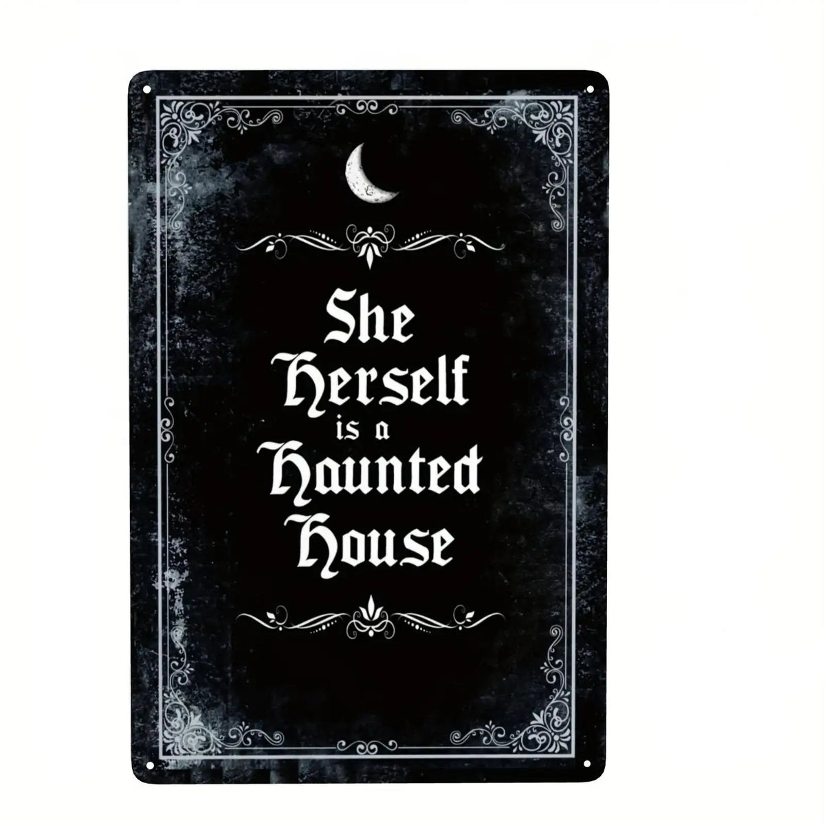 A black metal tin sign featuring a crescent moon and gothic script that reads She Herself is a Haunted House