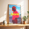 A canvas print featuring a person wearing a red helmet and pink shirt against a blue sky background.