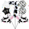 A set of cow print balloons shaped like the number 7 and various other cow-themed shapes for a party.
