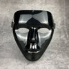 A glossy black masquerade mask with a stylized face and ear loops.