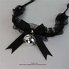 Black furry cat ear headband and tail costume set with a black ribbon bow
