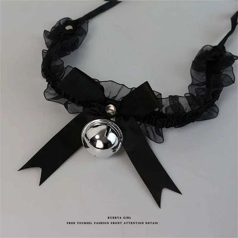 Black furry cat ear headband and tail costume set with a black ribbon bow