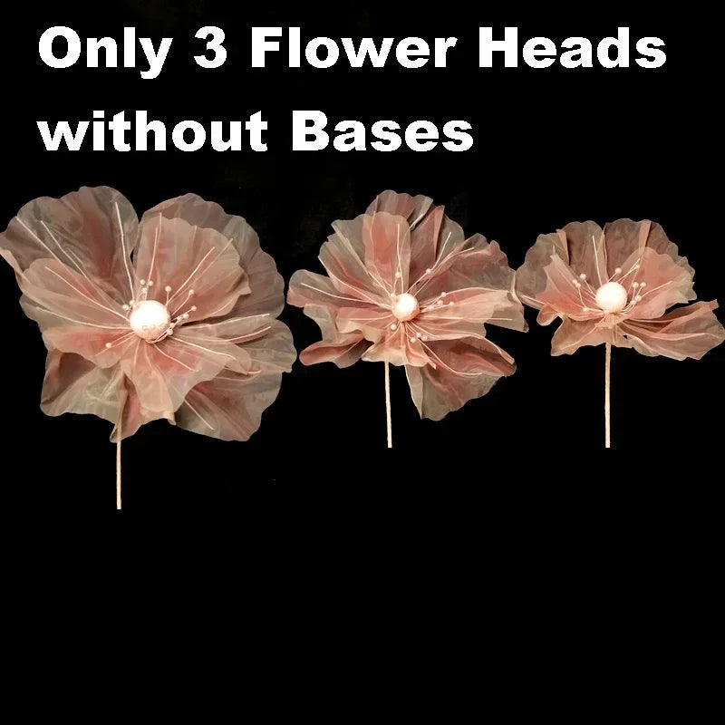 Three large, dried pink velvet mesh flower heads without bases displayed against a black background.