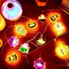 A collection of battery-operated Halloween string lights featuring various seasonal motifs like jack-o'-lanterns and ghosts.
