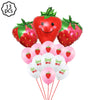 A kit of strawberry-themed party supplies including a large strawberry decoration and pink plates.
