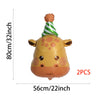 Two gold foil balloons shaped like a giraffe with a green striped hat