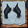 A pair of black bat simulation wings with measurements marked on a light gray background.