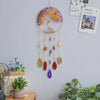 A crystal tree of life sun catcher wall decor featuring a circular frame with colorful petals and hanging crystals.