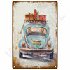 A vintage blue metal wall sign depicting an old car with stacked boxes on the roof.