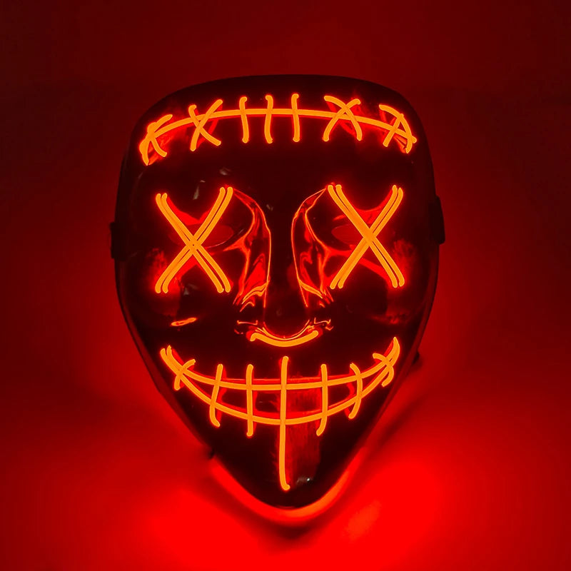 A glowing orange LED mask shaped like a stylized, menacing face with crisscrossing lines and a wide grin.