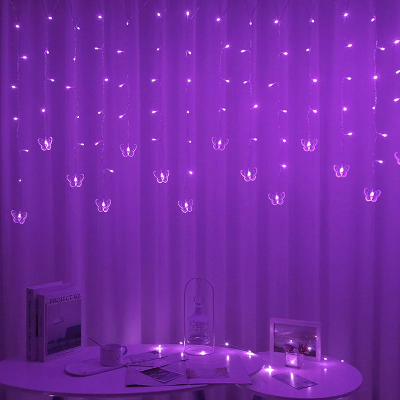 Purple LED butterfly curtain lights hanging in a vertical drape against a white background.