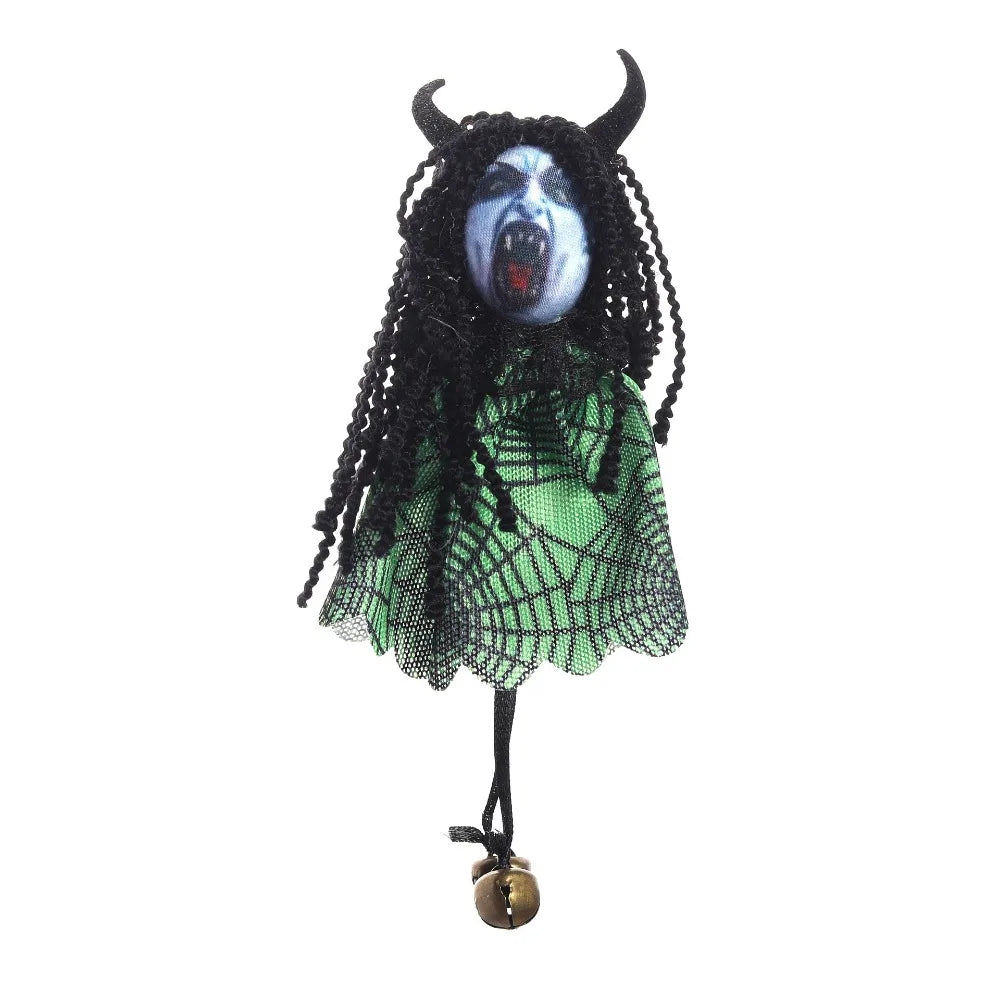 A scarecrow witch ornament featuring a black, hairy face with glowing blue eyes and a green netting dress.