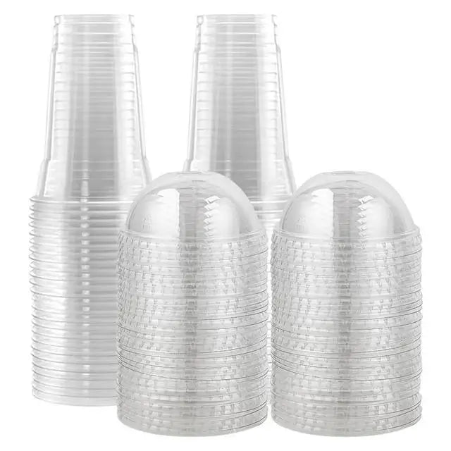 A stack of clear disposable plastic cups with lids for cold drinks.