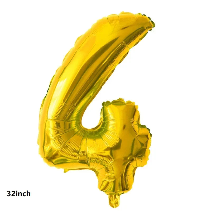 A shiny gold latex balloon shaped like the number 4, used for party decorations.