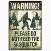 A weathered wooden sign with the text WARNING PLEASE DO NOT FEED THE SASQUATCH.