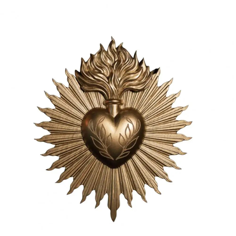 A golden wall plaque featuring a radiant sunburst design surrounding an engraved heart.