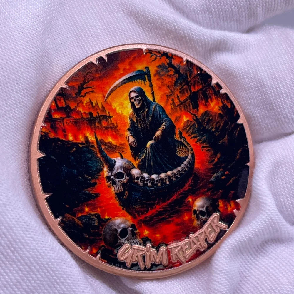 A copper challenge coin featuring a Grim Reaper design with a skull and pirate theme.