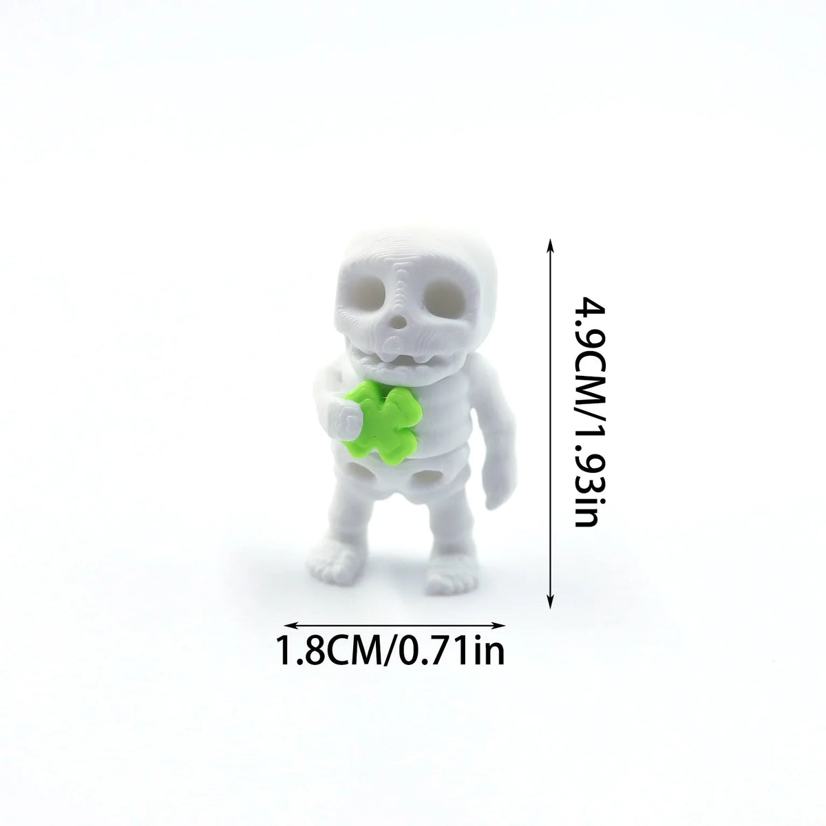A white skull figurine with a green heart shape attached, shown against a white background.