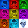 A collection of eight LED glow skull masks displayed in various colors including blue, red, green, pink, yellow, orange, and 
