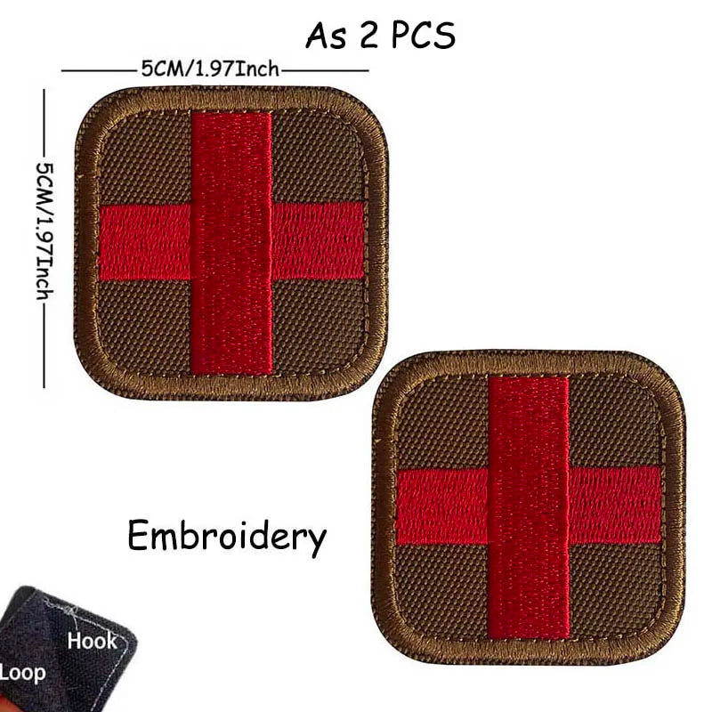 Two brown fabric patches with red embroidery featuring a cross design and a hook loop.