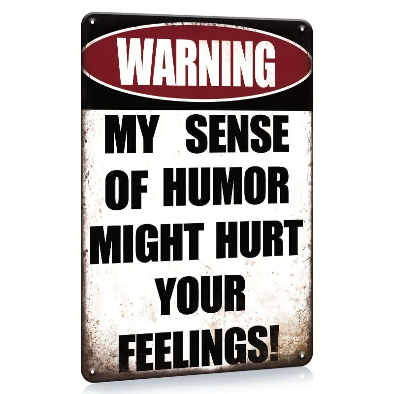 A vintage metal tin sign with a warning label that reads My Sense of Humor Might Hurt Your Feelings