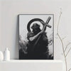 Black and white canvas art print depicting a silhouette of a figure holding a cross.