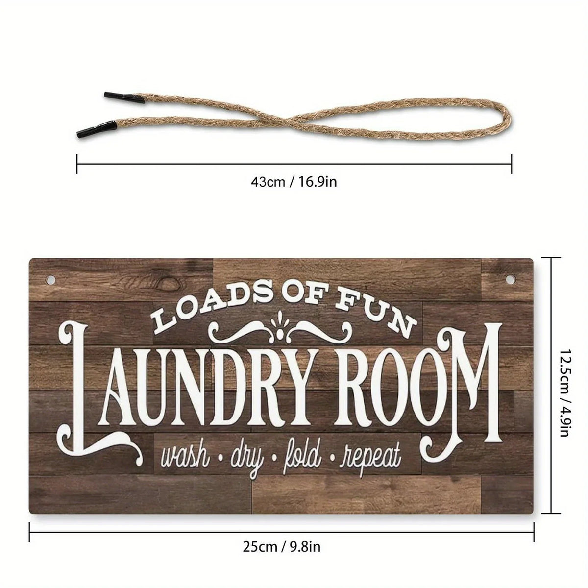 A wooden sign with the text LOADS OF FUN LAUNDRY ROOM wash dry fold repeat and a rope for hanging