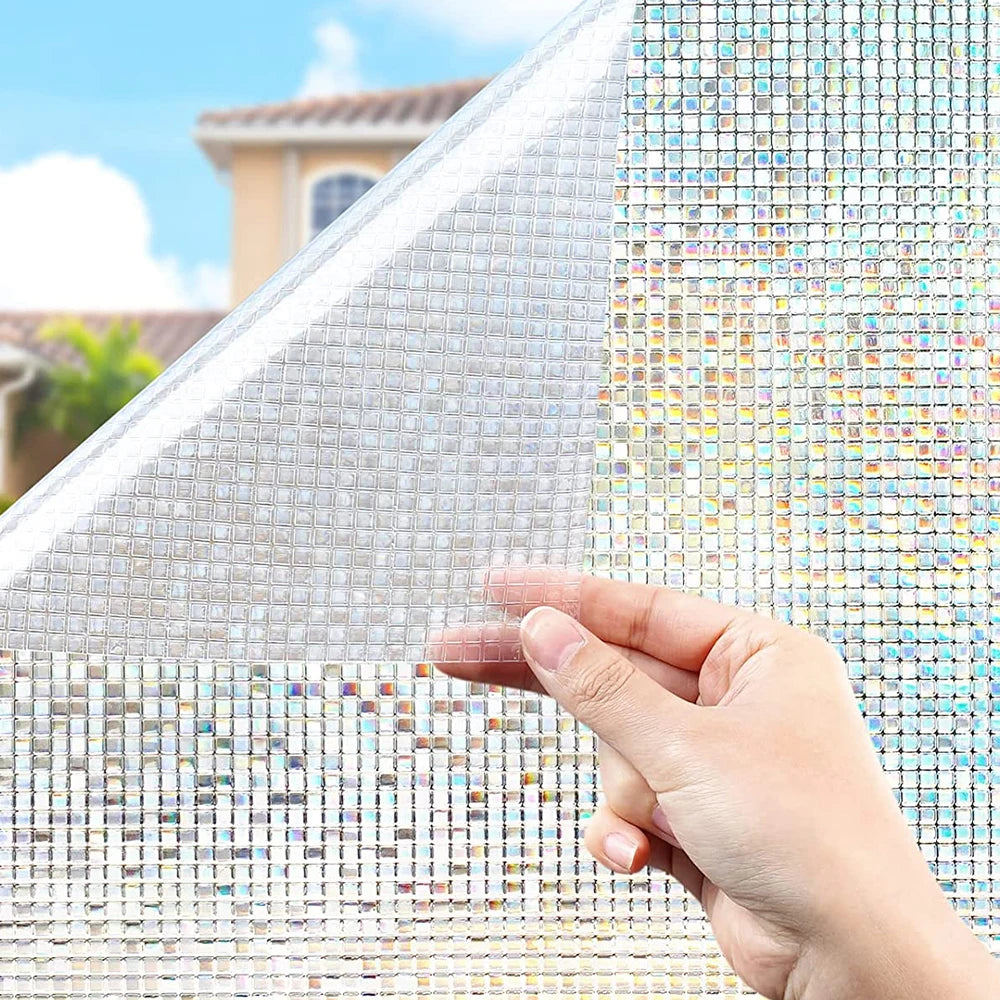 A hand is touching a sheet of frosted window privacy film, showing its texture and light diffusion.